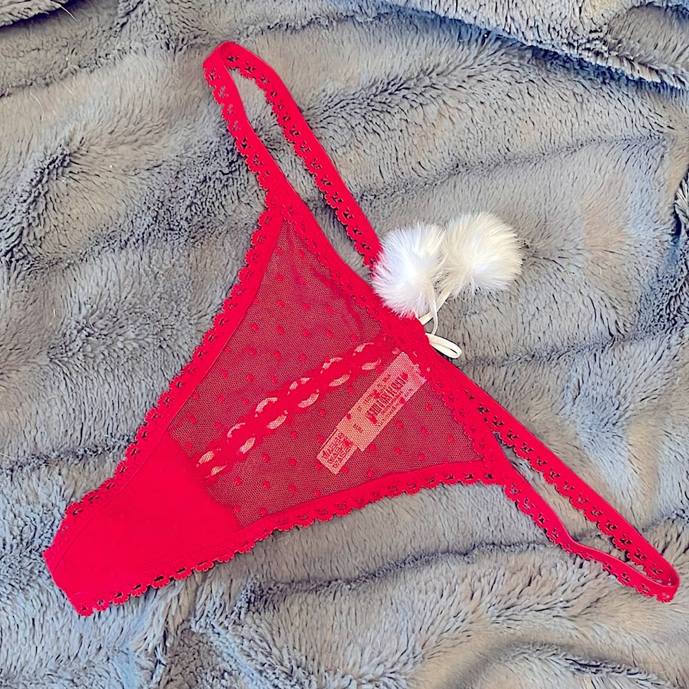 Victoria’s Secret V-string panty with lace up detail and pompoms size medium